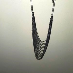 Layered silver chain necklace.